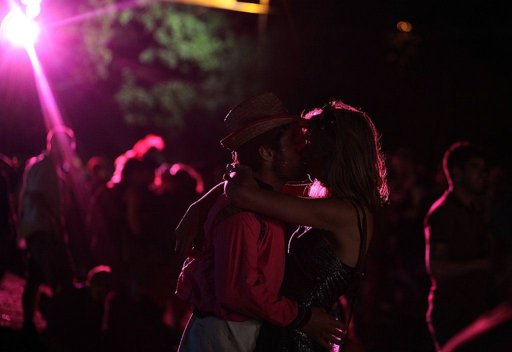 These festivalgoers smooched in the moonlight (and florescent light) of Glastonbury festival.
These festivalgoers smooched in the moonlight (and florescent light) of Glastonbury festival.