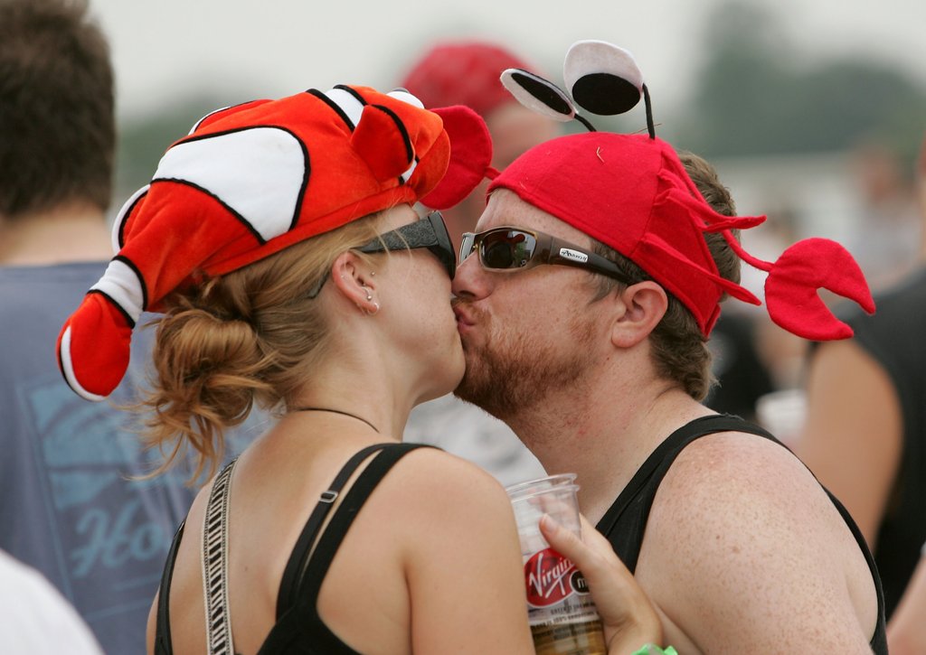 A couple kissed in fish hats at the Virgin Festival in Baltimore, MD.
A couple kissed in fish hats at the Virgin Festival in Baltimore, MD.