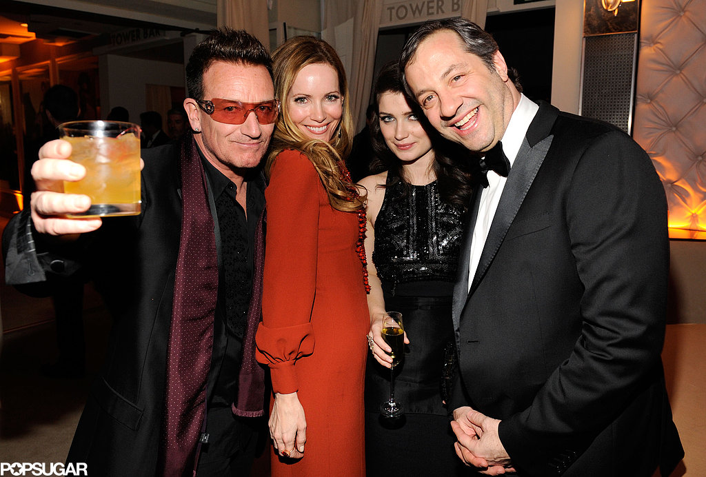 Bono raised his drink and posed with Leslie Mann, Eve Hewson, and Judd Apatow at the Vanity Fair party.
Bono raised his drink and posed with Leslie Mann, Eve Hewson, and Judd Apatow at the Vanity Fair party.