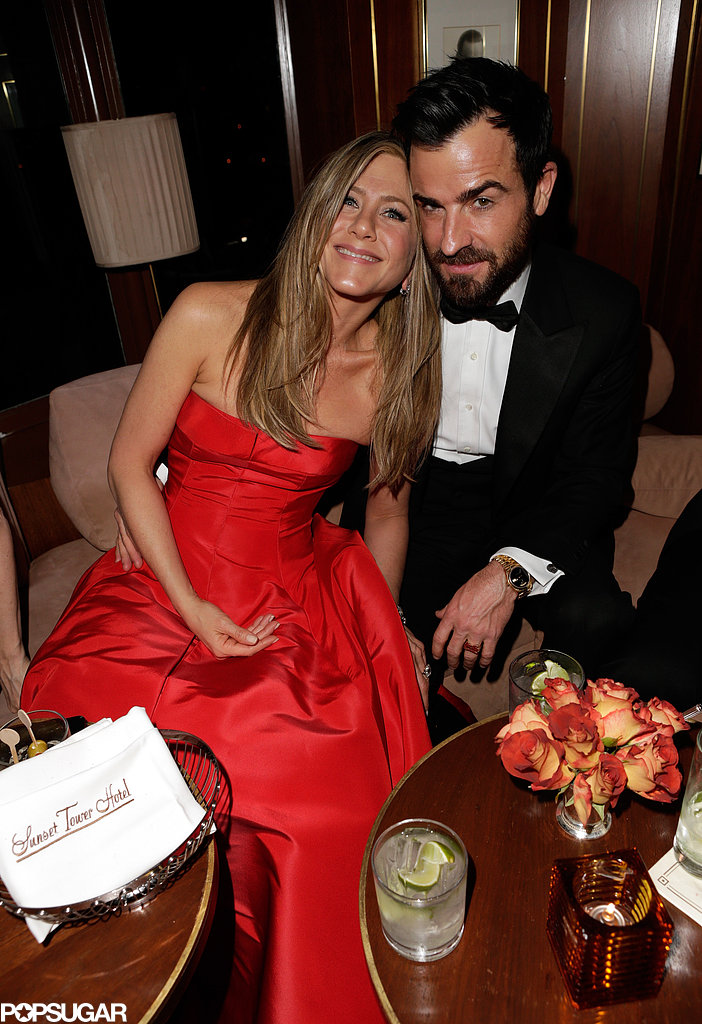 Jennifer Aniston cuddled up to fiancé Justin Theroux at Vanity Fair's Oscar afterparty.
Jennifer Aniston cuddled up to fiancé Justin Theroux at Vanity Fair's Oscar afterparty.