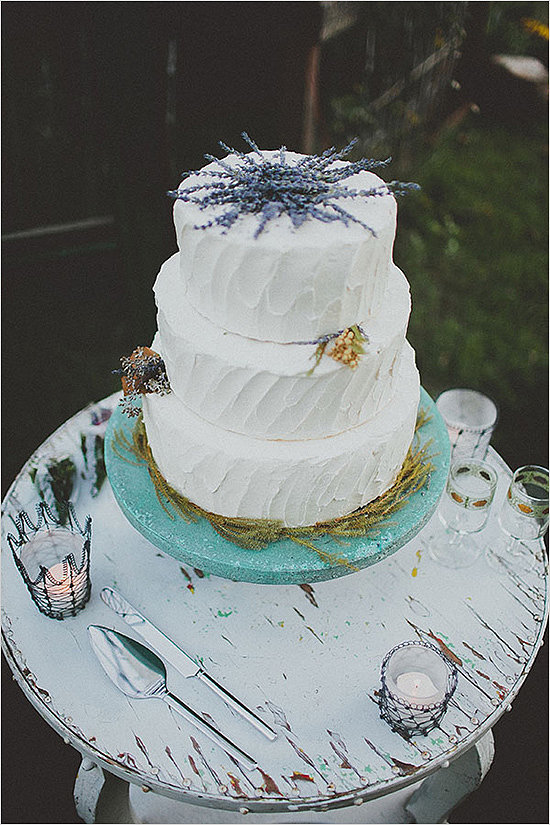 With lavender peeking out from the top, this charming white cake has all the potential to steal the show.
Photo by Blue Vinyl Creative via Wedding Chicks
With lavender peeking out from the top, this charming white cake has all the potential to steal the show.
Photo by Blue Vinyl Creative via Wedding Chicks