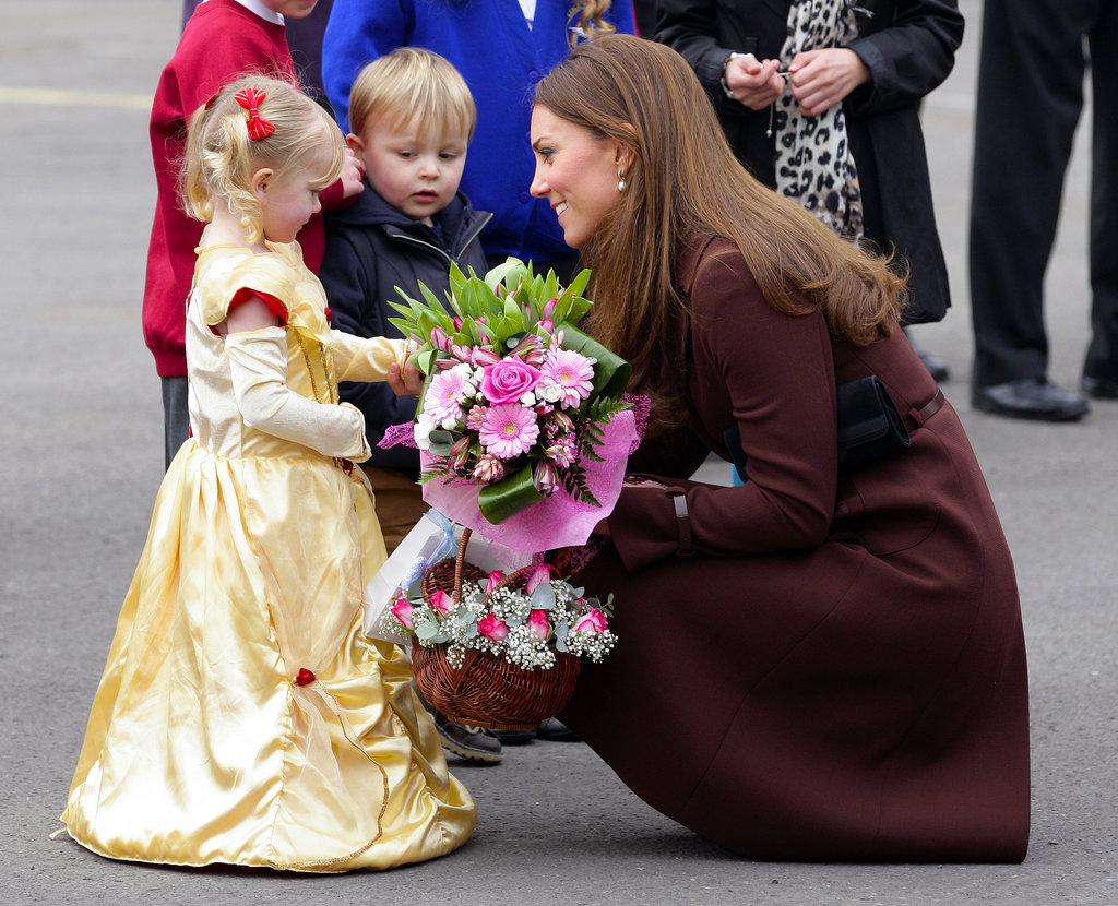Kate chatted with a girl in a princess costume in March 2013 when she toured the town of Grimsby in England.
Kate chatted with a girl in a princess costume in March 2013 when she toured the town of Grimsby in England.
