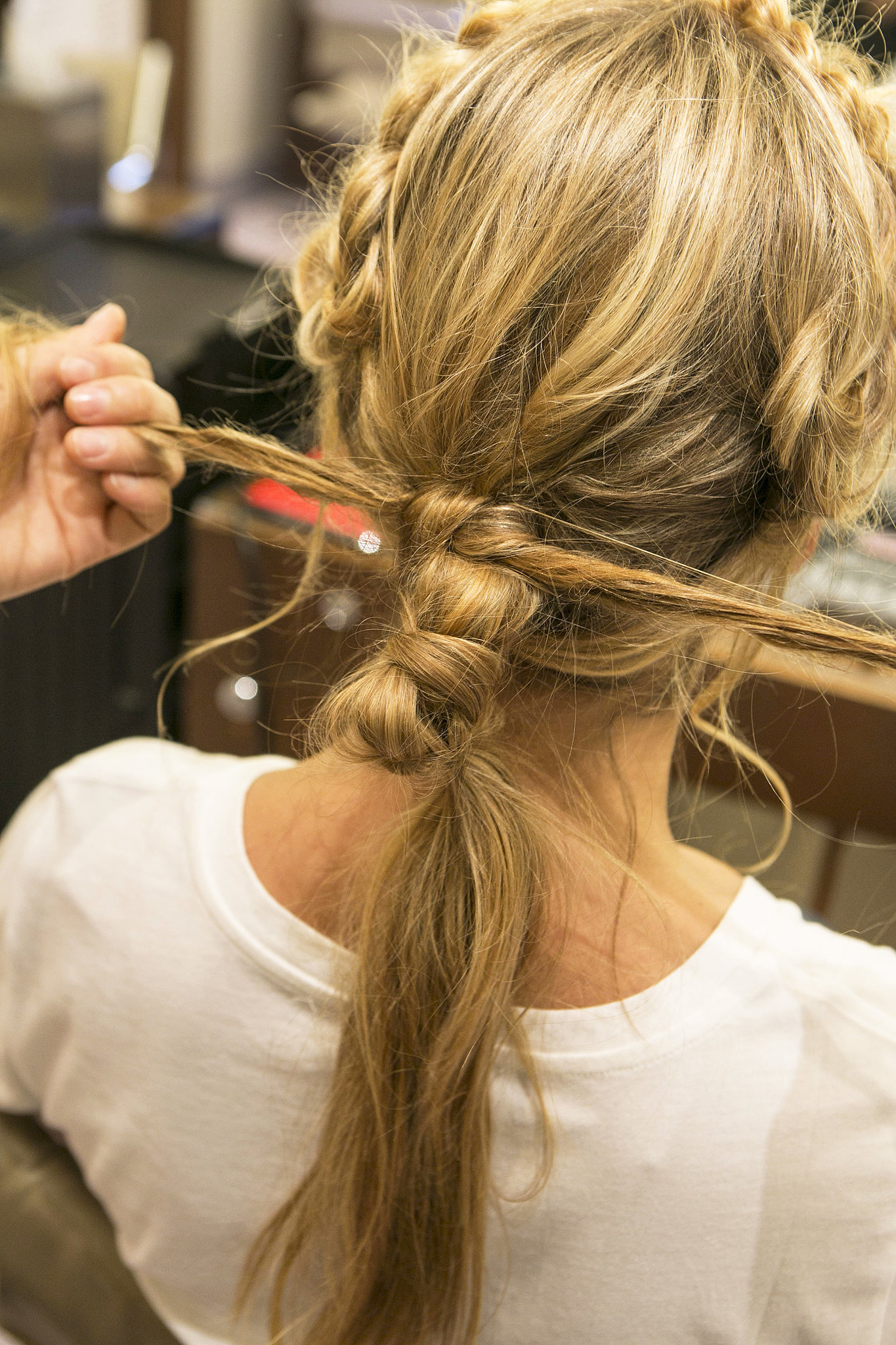 Tie the two ends into a knot around the top of the ponytail base. DIY