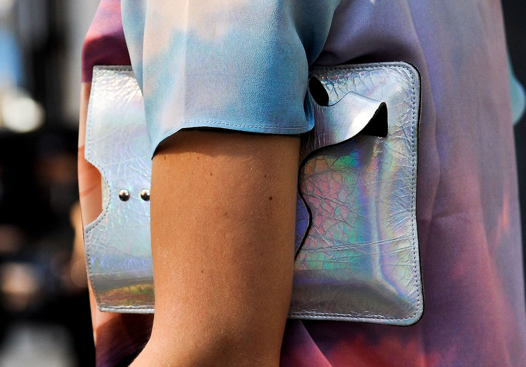A holographic clutch against a little ombre is completely eye-catching.
A holographic clutch against a little ombre is completely eye-catching.
