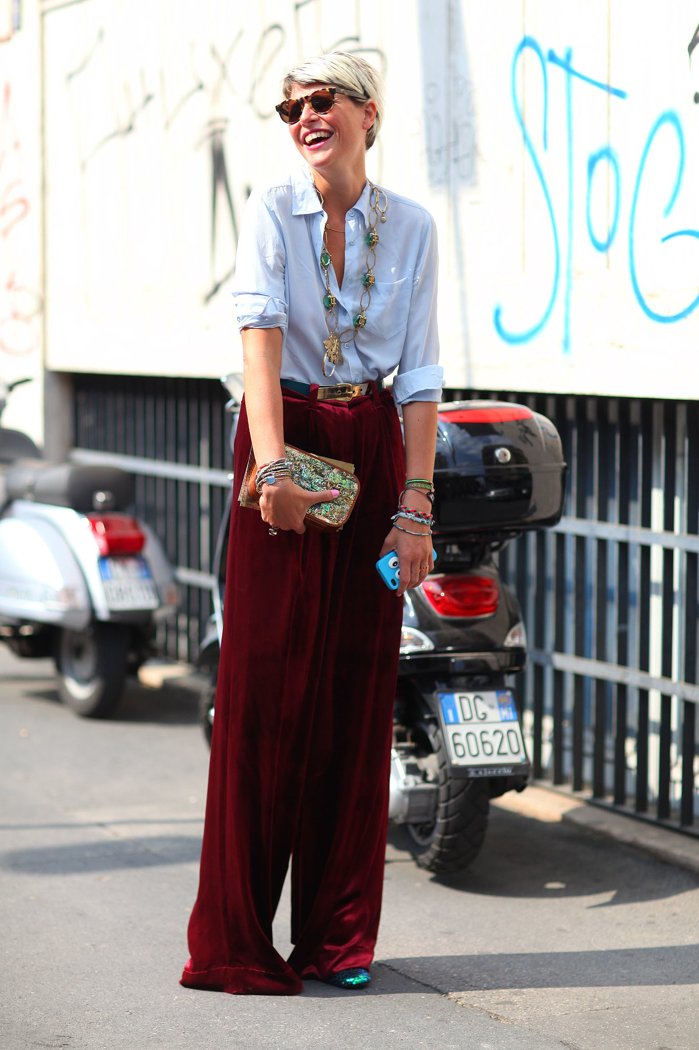 A classic button-down and wide-leg pants get brightened up with a | All ...