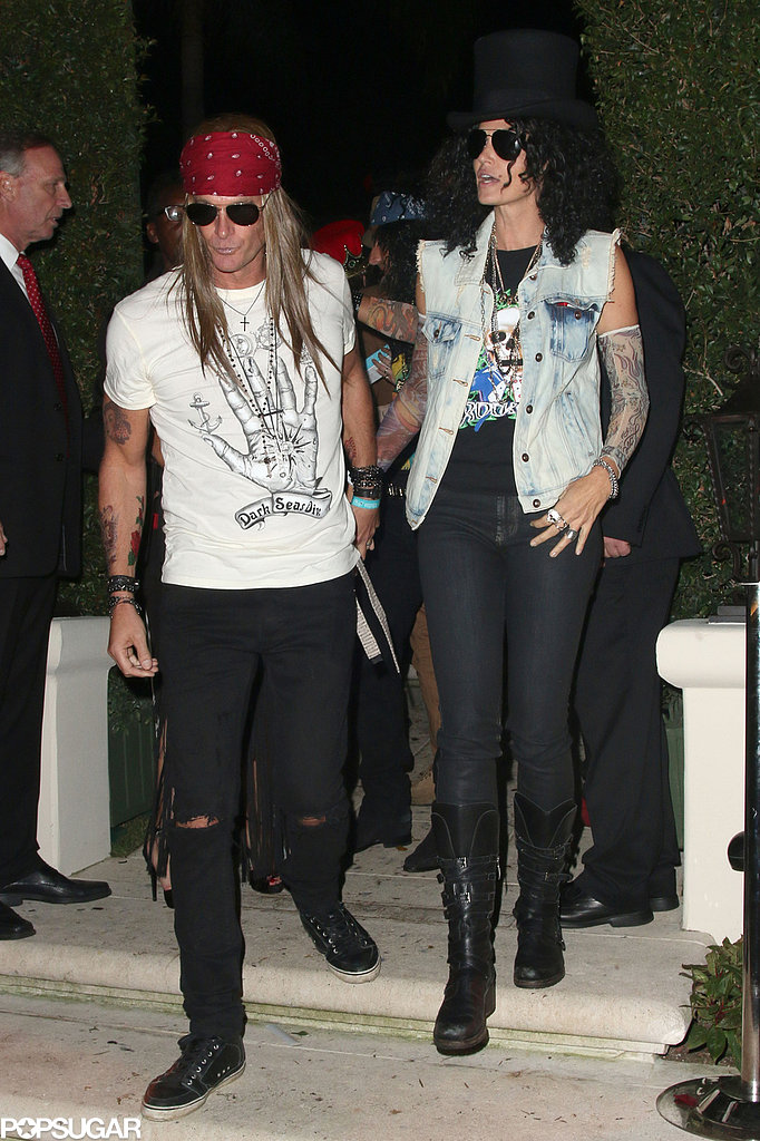 Cindy Crawford and her husband went as Guns 'n' Roses bandmembers Slash and Axl Rose to the Casamigos Halloween Party.
Cindy Crawford and her husband went as Guns 'n' Roses bandmembers Slash and Axl Rose to the Casamigos Halloween Party.
