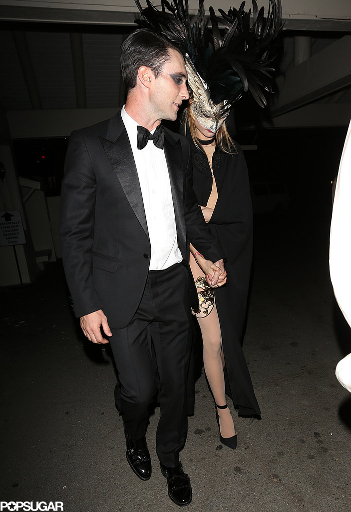 Adam Levine and Behati Prinsloo wore classy masquerade ensembles.
Adam Levine and Behati Prinsloo wore classy masquerade ensembles.