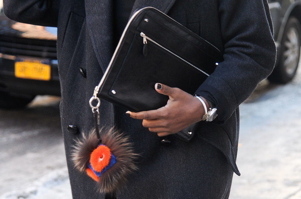 Perfect Fashion Week accessories include a Fendi charm and sleek clutch.
Perfect Fashion Week accessories include a Fendi charm and sleek clutch.