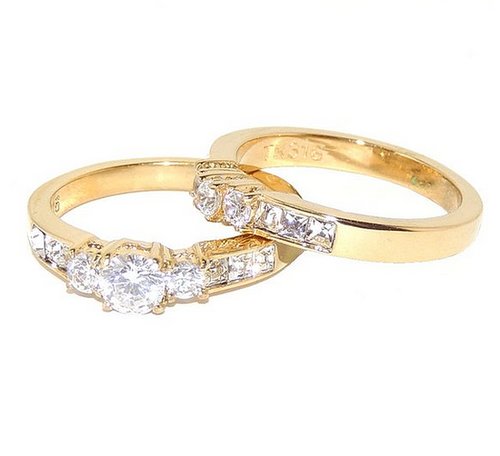 You can't get more traditional than this gold wedding set .