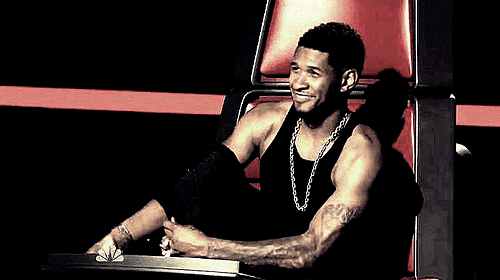 Usher flirtatiously took his jacket off during an episode of The Voice in 2013.
Usher flirtatiously took his jacket off during an episode of The Voice in 2013.
