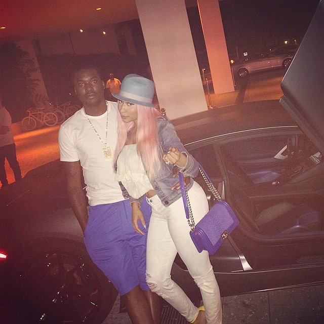The rapper and Meek Mill, who went public with their relationship last February, have been hanging out in Miami — in color-coordinating pops of purple, no less. 

