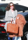 Anne Hathaway Gives Us a Peek at Her Blossoming Baby Bump During a Trip to the Gym