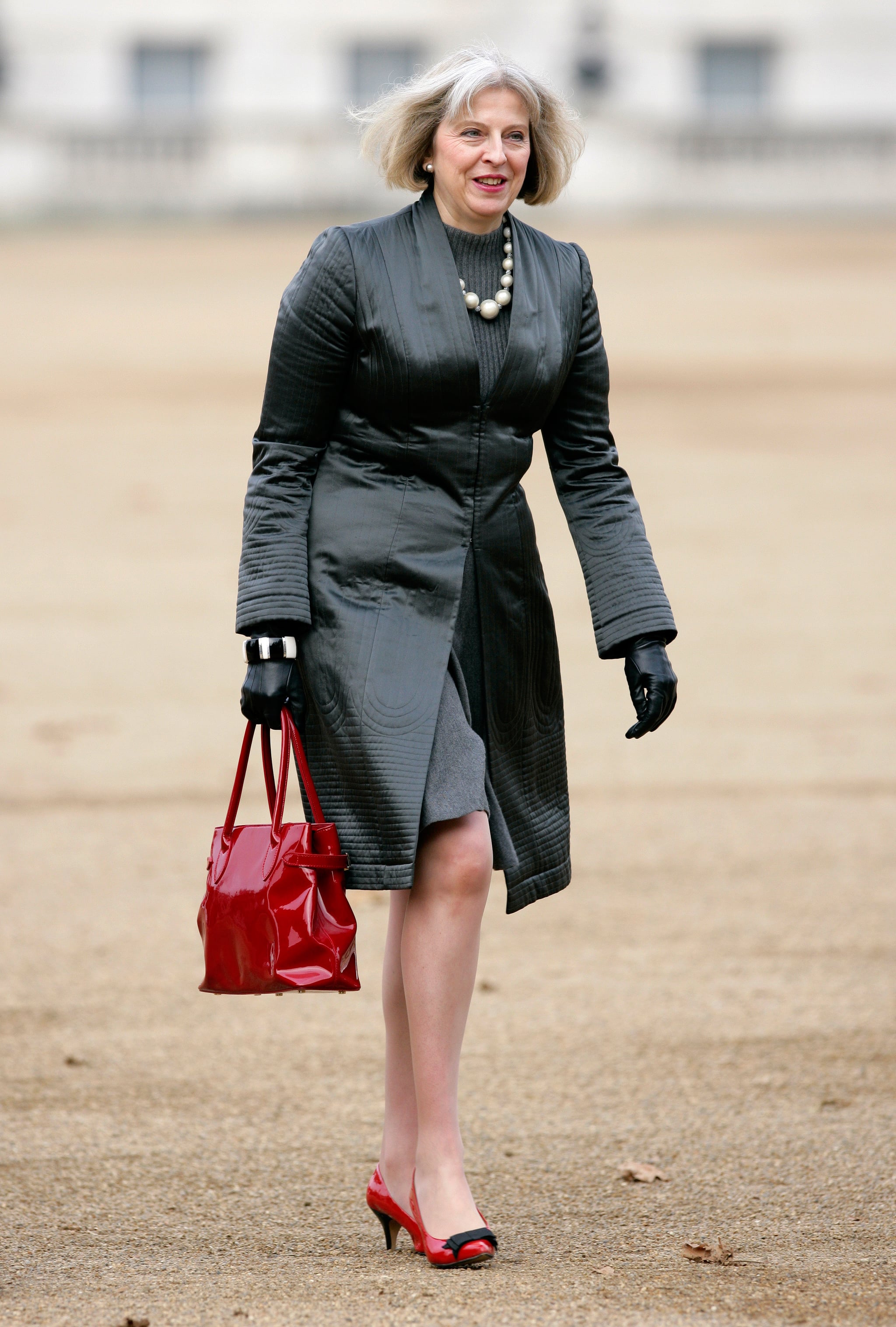A Classic Red Handbag British Prime Minster Theresa May Has a Style