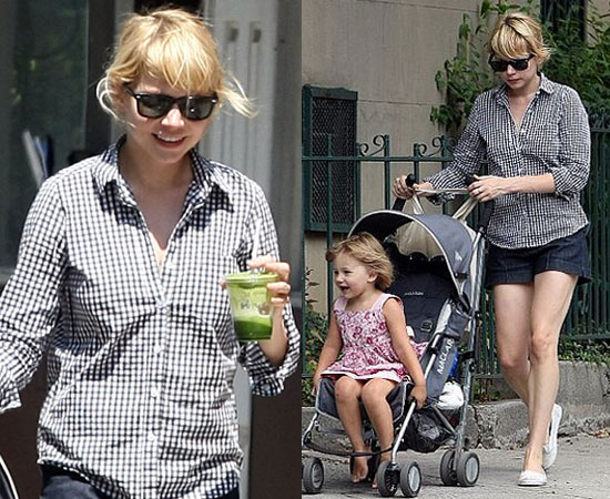 Michelle Williams in a black and white gingham shirt with baby Matilda Michelle Williams in a black and white gingham shirt with baby Matilda