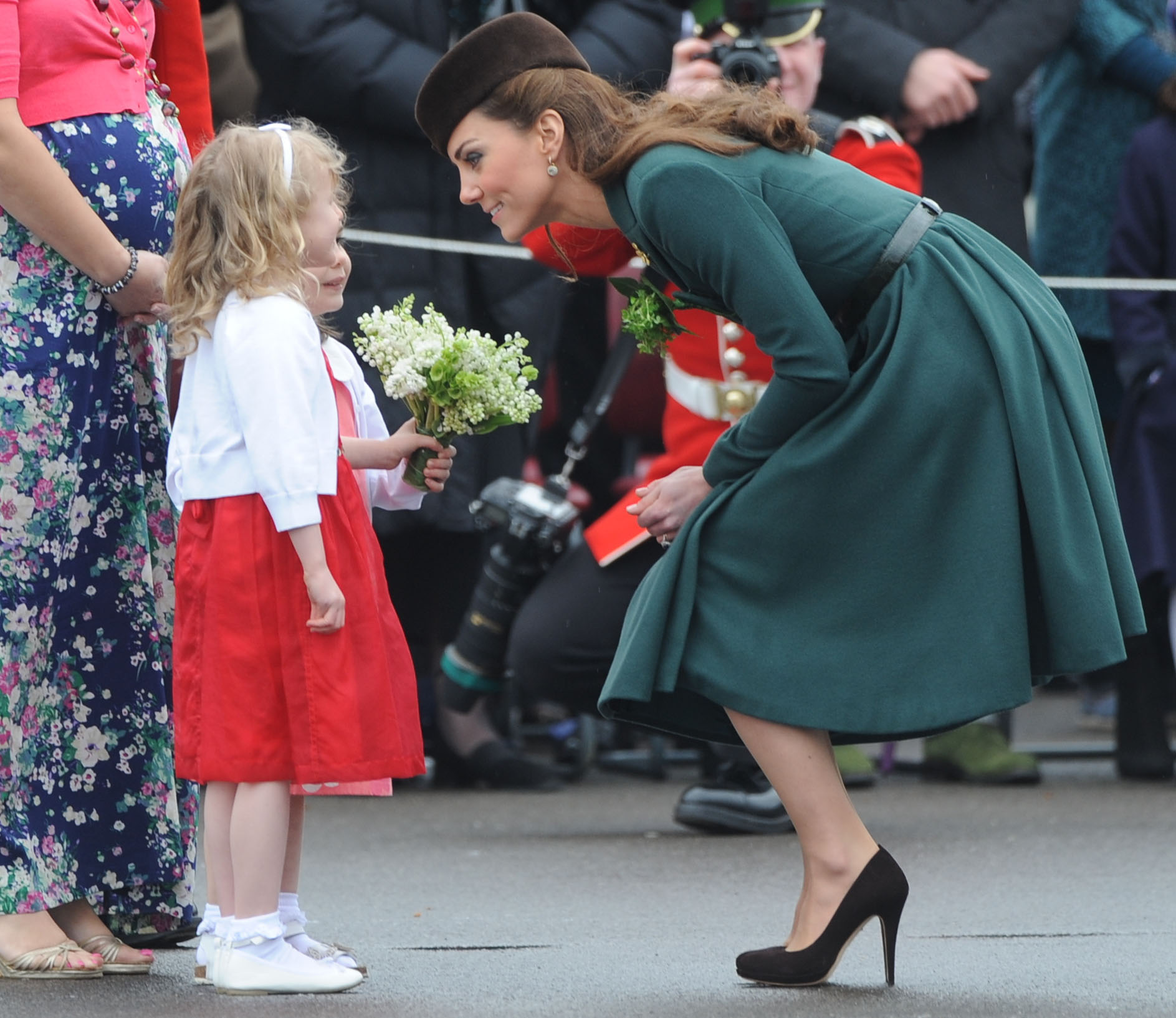 Kate bent down to chat eye to eye with a young fan in Aldershot, | Why ...