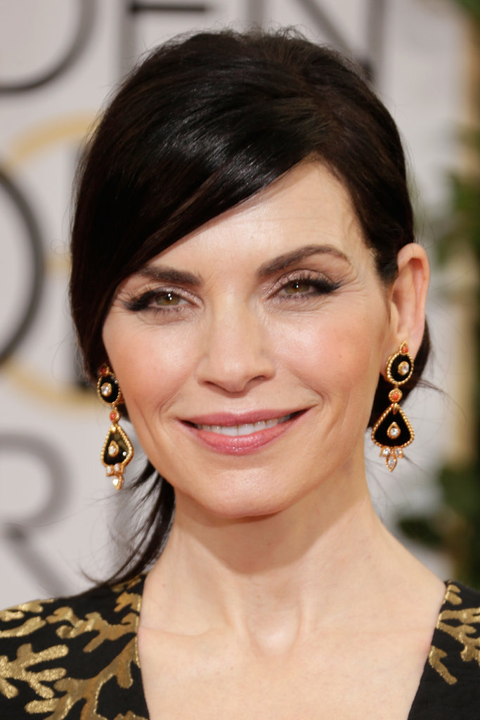 Julianna Margulies echoed the black and gold of her gown with Van ...