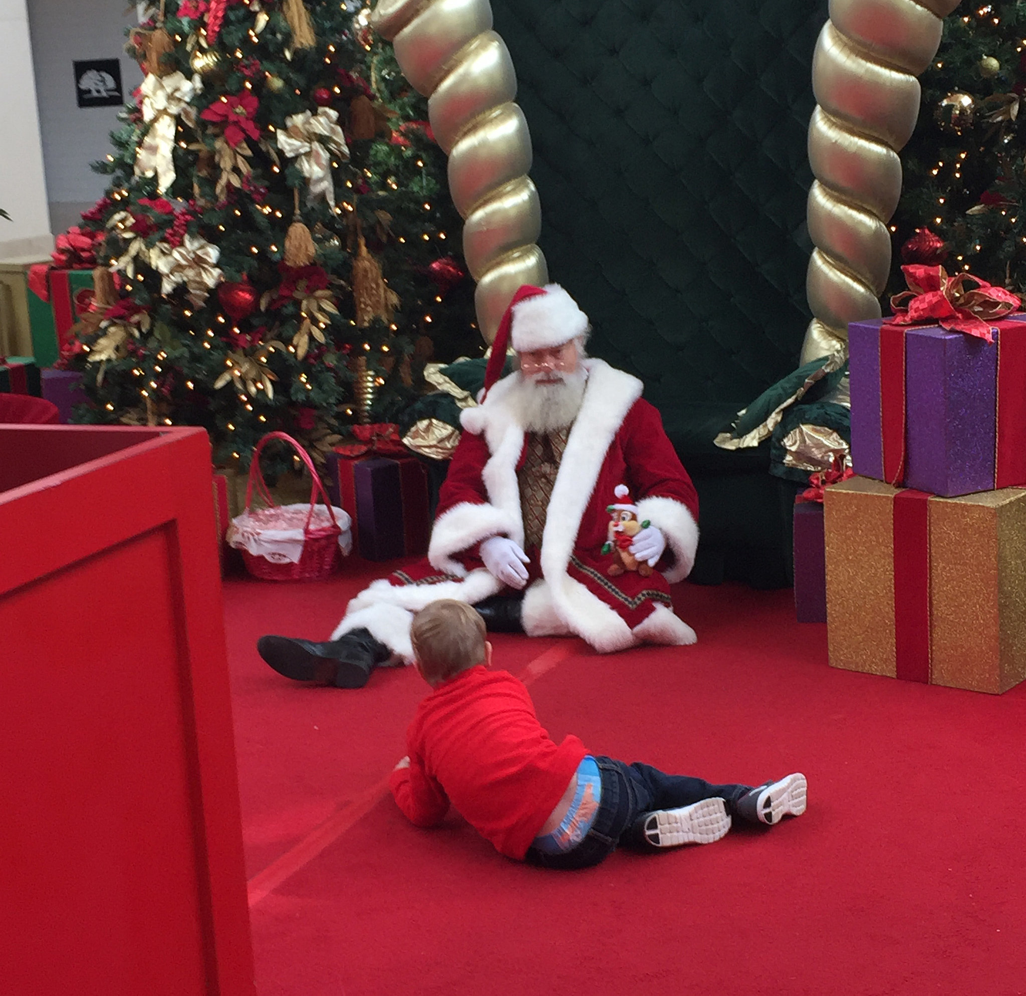 Mall Santa Gets on Floor to Comfort Boy With Autism ...