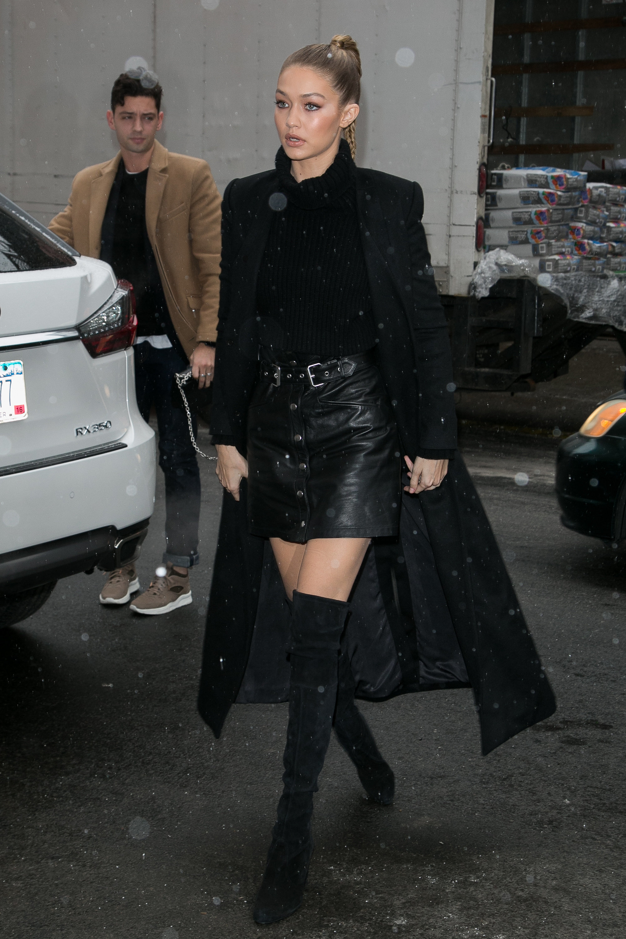 Gigi Hadid wearing a skirt from The Kooples, a Blaq sweater, and | The ...